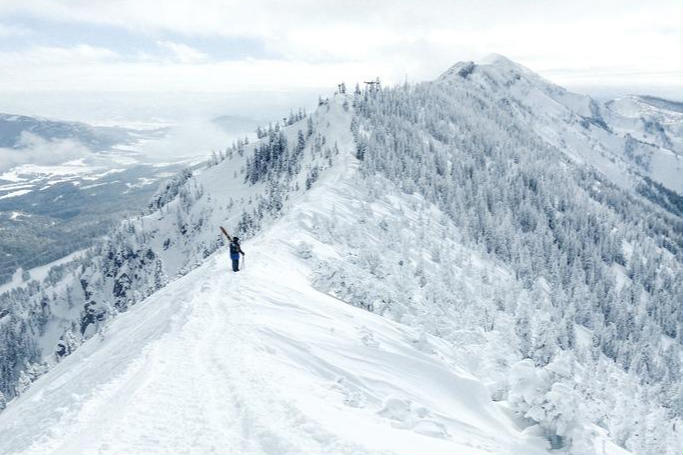A skier hikes across the ridge at Bridger Bowl, just outside of Bozeman, MT.